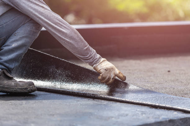 Professional Waterproofing technician working in Montezuma, OH